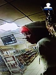 A suspect in the killing of a 91-year-old Detroit man is shown buying gasoline at a service station. (Photo: Detroit Police)